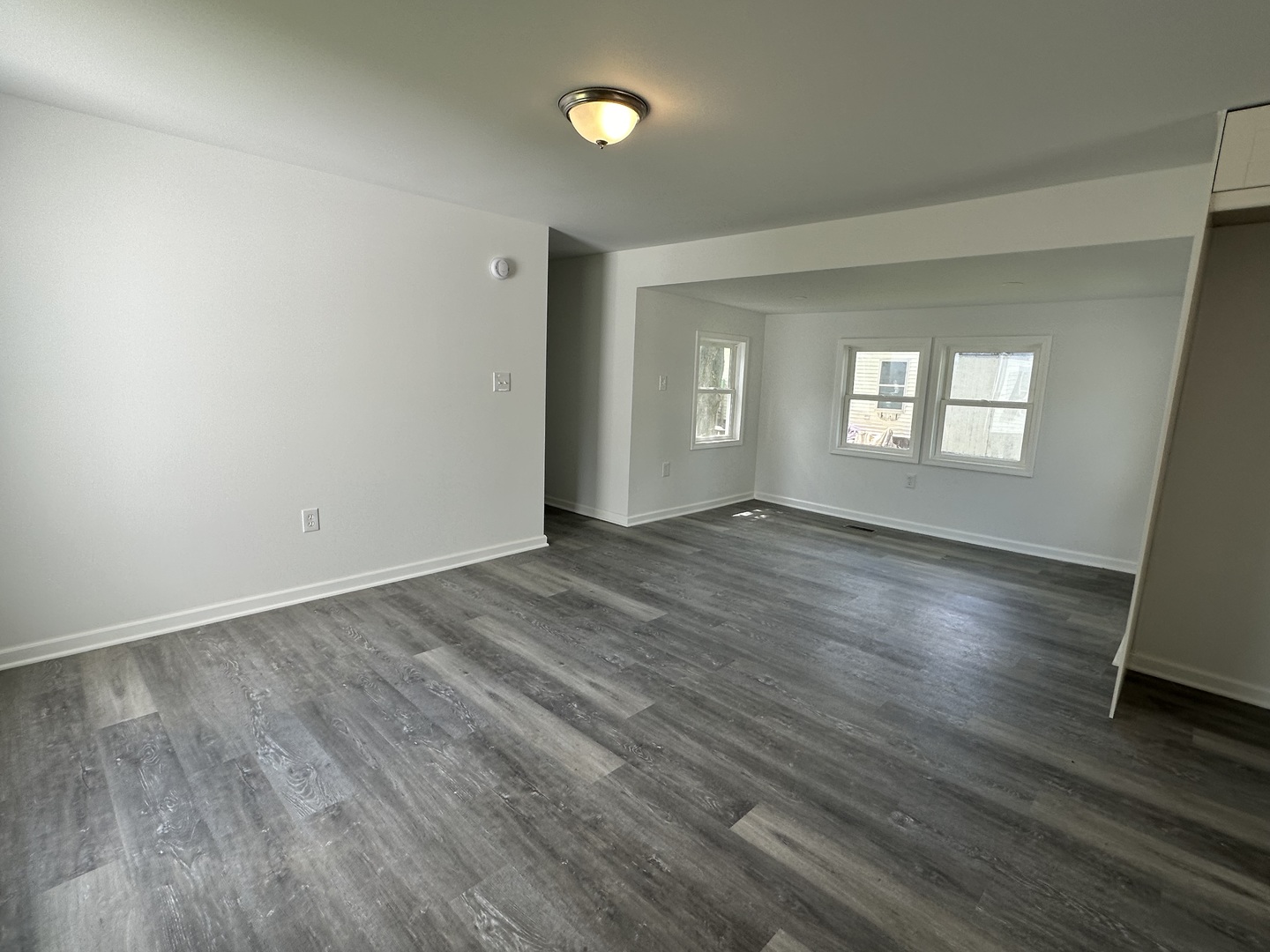 66 Candlegate Circle Matteson, IL 60443 - Photo 3 of 21 an empty room with wooden floor and windows