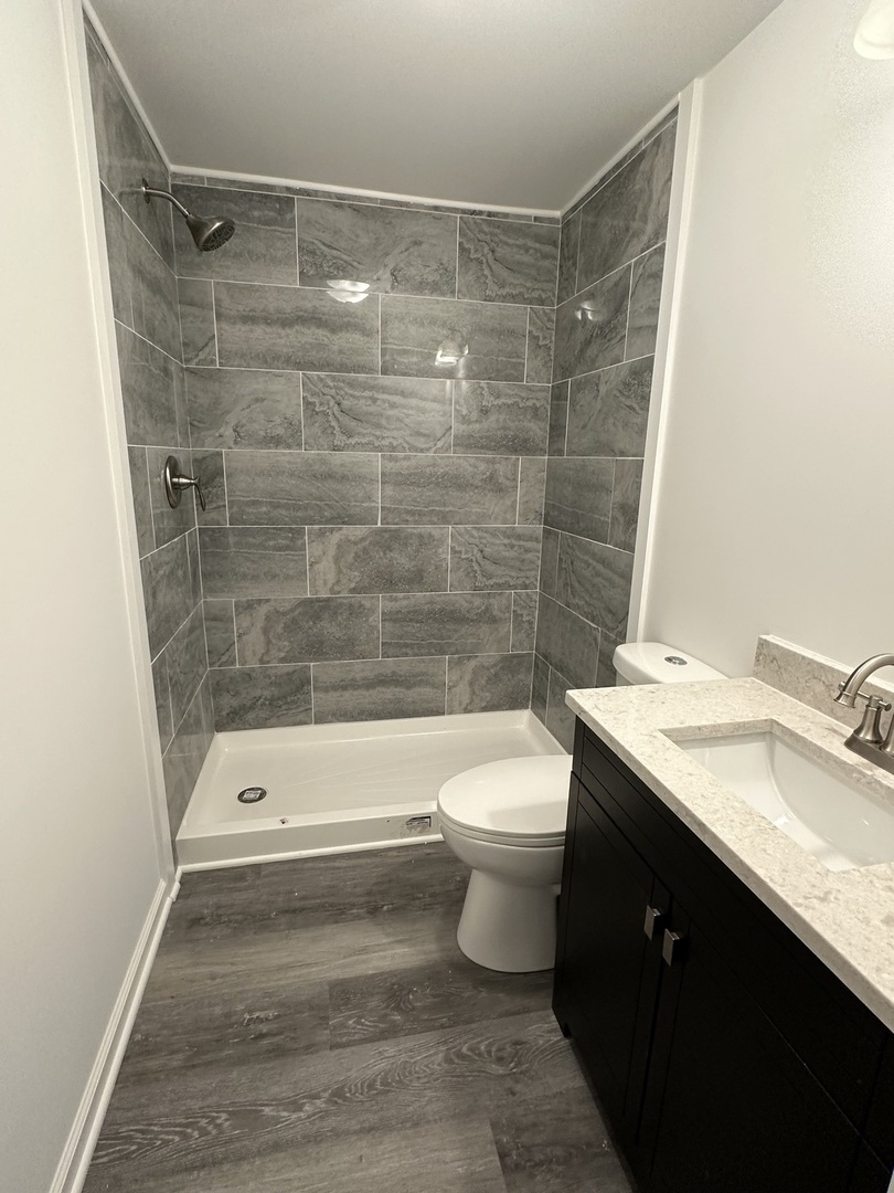 66 Candlegate Circle Matteson, IL 60443 - Photo 5 of 21 a bathroom with a granite countertop bathtub shower sink vanity and toilet