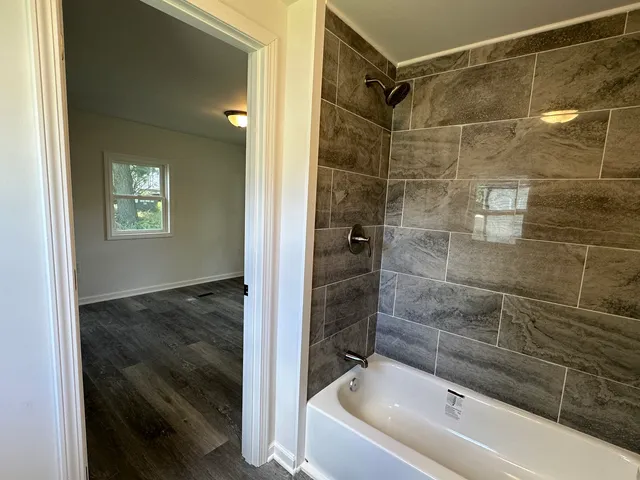 a bathroom with a shower and bathtub