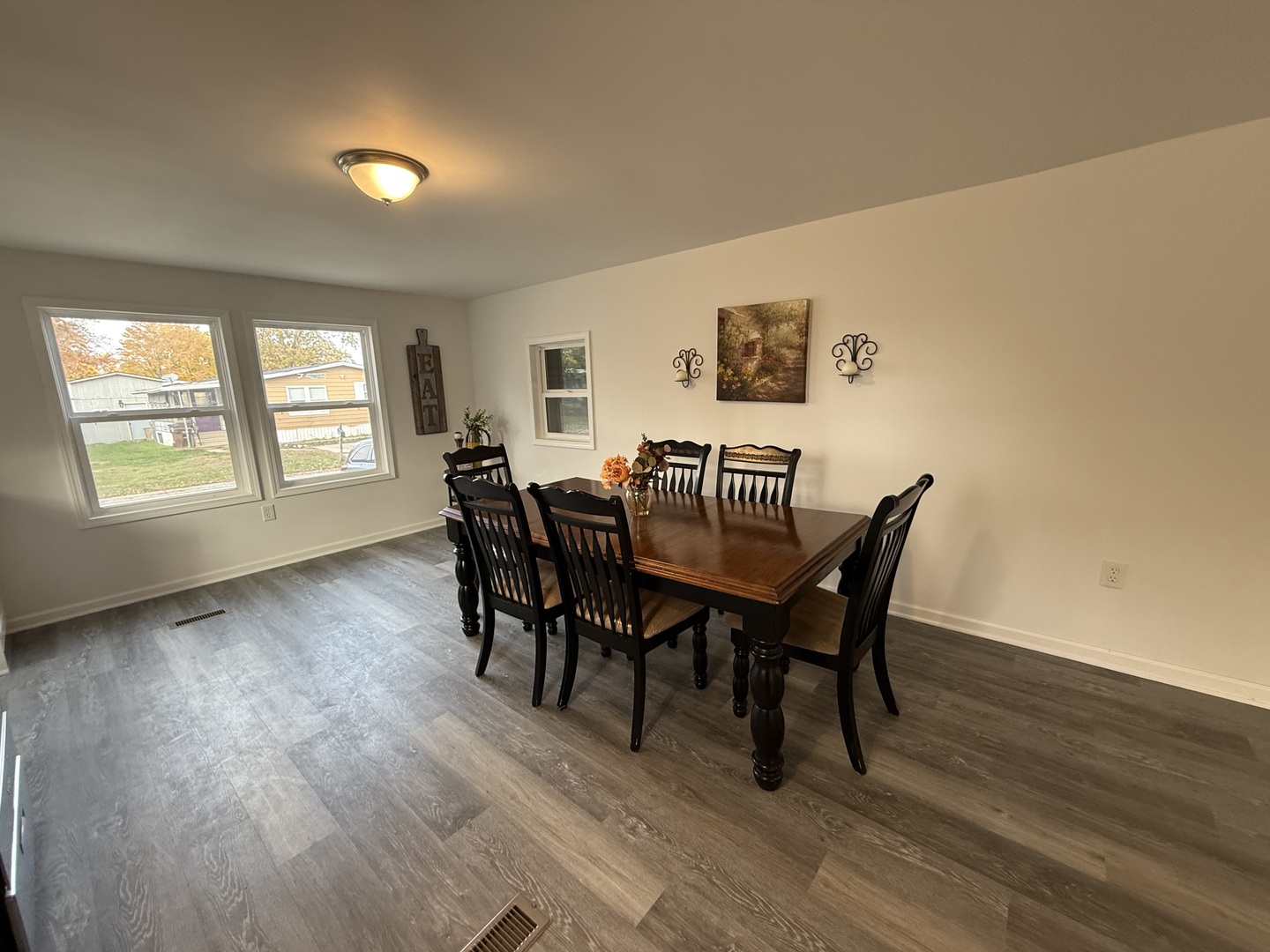 66 Candlegate Circle Matteson, IL 60443 - Photo 10 of 21 a view of a dining room with furniture and wooden floor