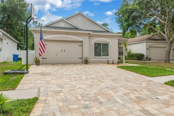 a view of a house with a yard