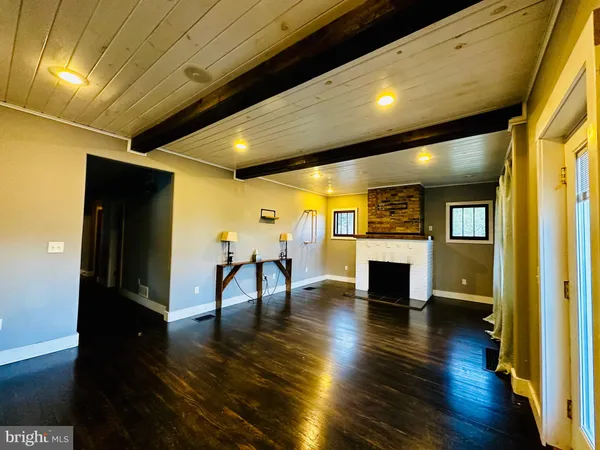 a view of dining room with furniture and wooden floor