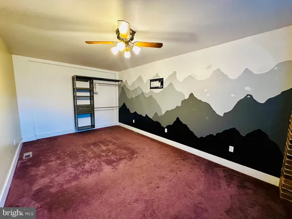 a view of an empty room with windows