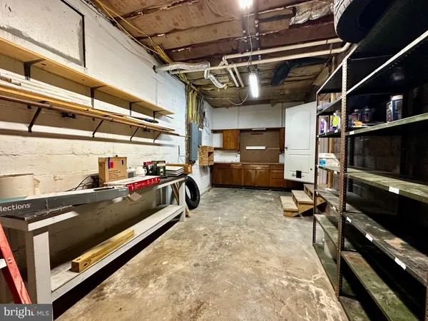 a view of a chair and table in the backyard