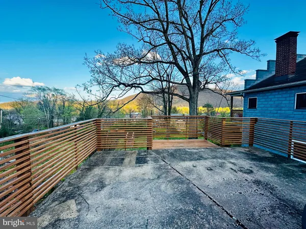 a view of a house with many windows and a yard