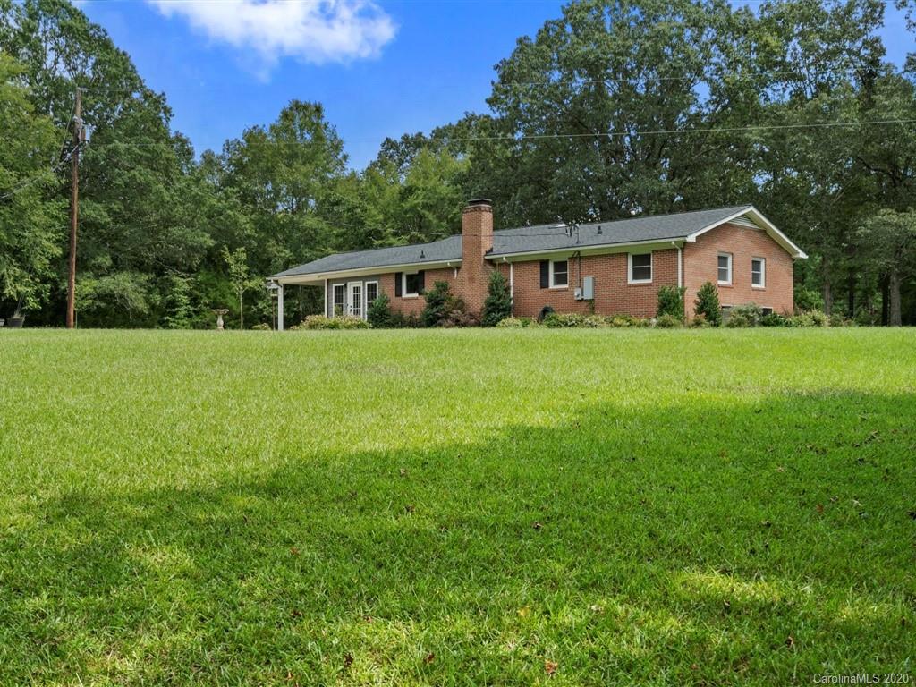 2402 State Rd S-29-305 Lancaster, SC 29720 - Photo 3 of 40 a front of a house with a garden