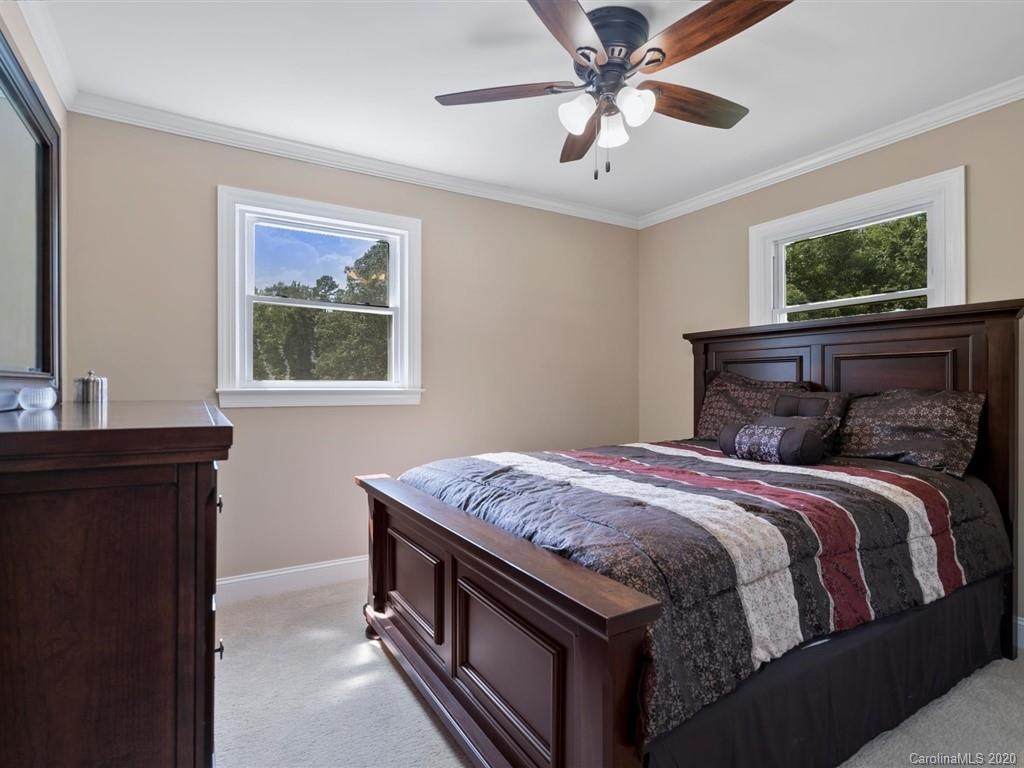 2402 State Rd S-29-305 Lancaster, SC 29720 - Photo 22 of 40 a bedroom with a bed and a window