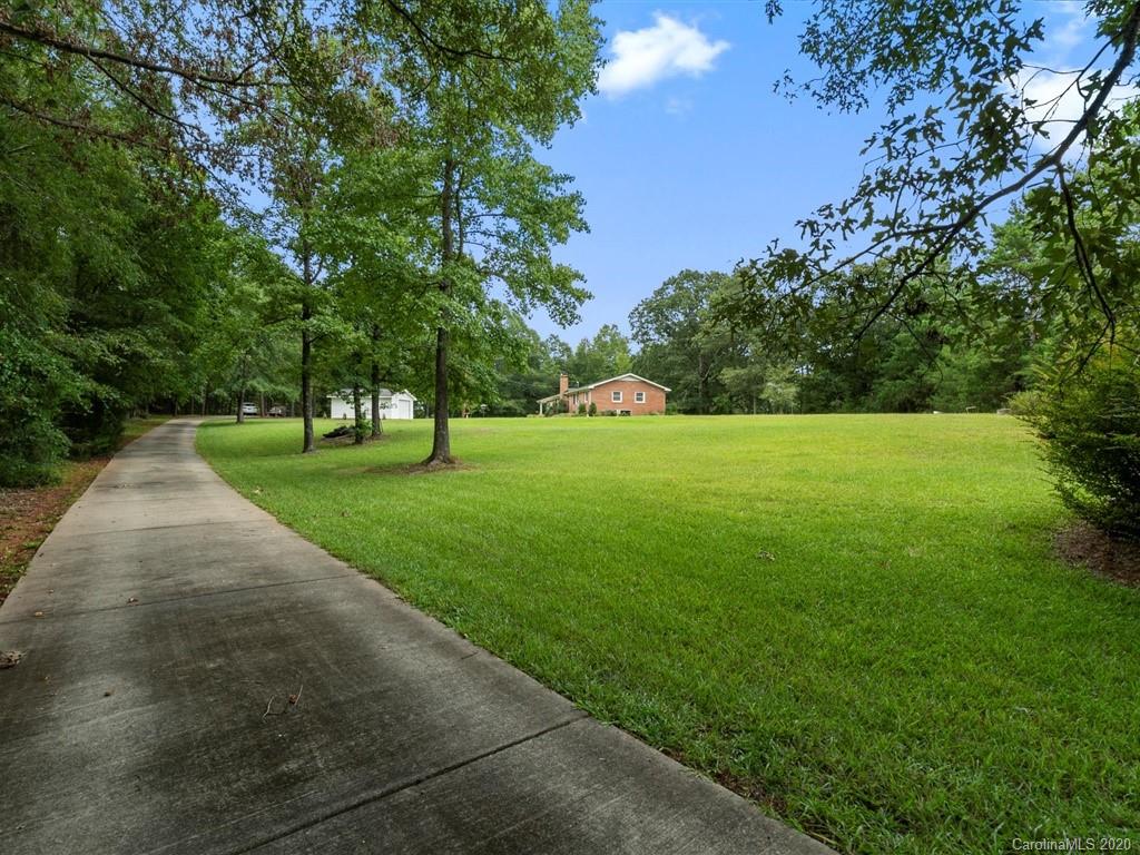 2402 State Rd S-29-305 Lancaster, SC 29720 - Photo 40 of 40 a view of grassy field with benches