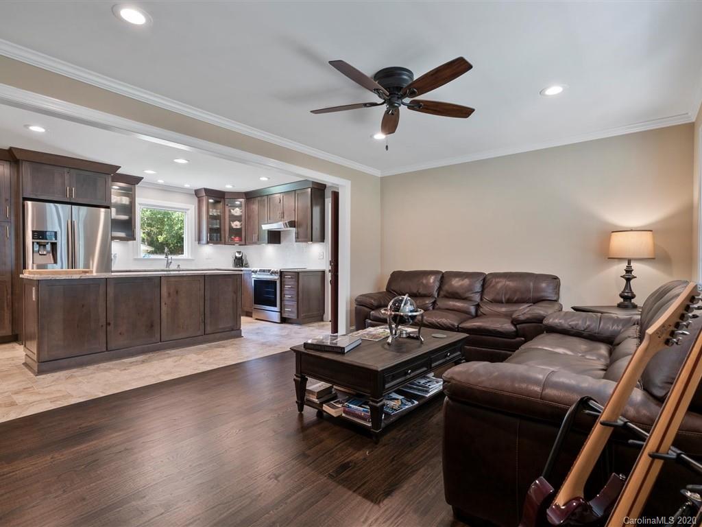 2402 State Rd S-29-305 Lancaster, SC 29720 - Photo 8 of 40 a living room with furniture and a fireplace