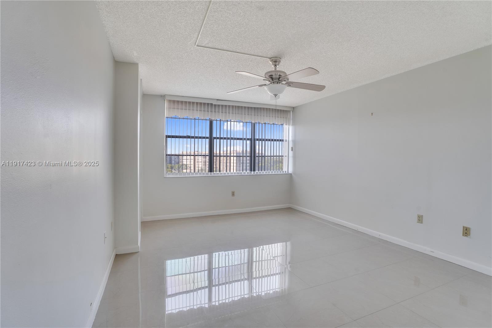 1200 St Charles Place, Unit 716 Pembroke Pines, FL 33026 - Photo 11 of 29 a view of an empty room with a window
