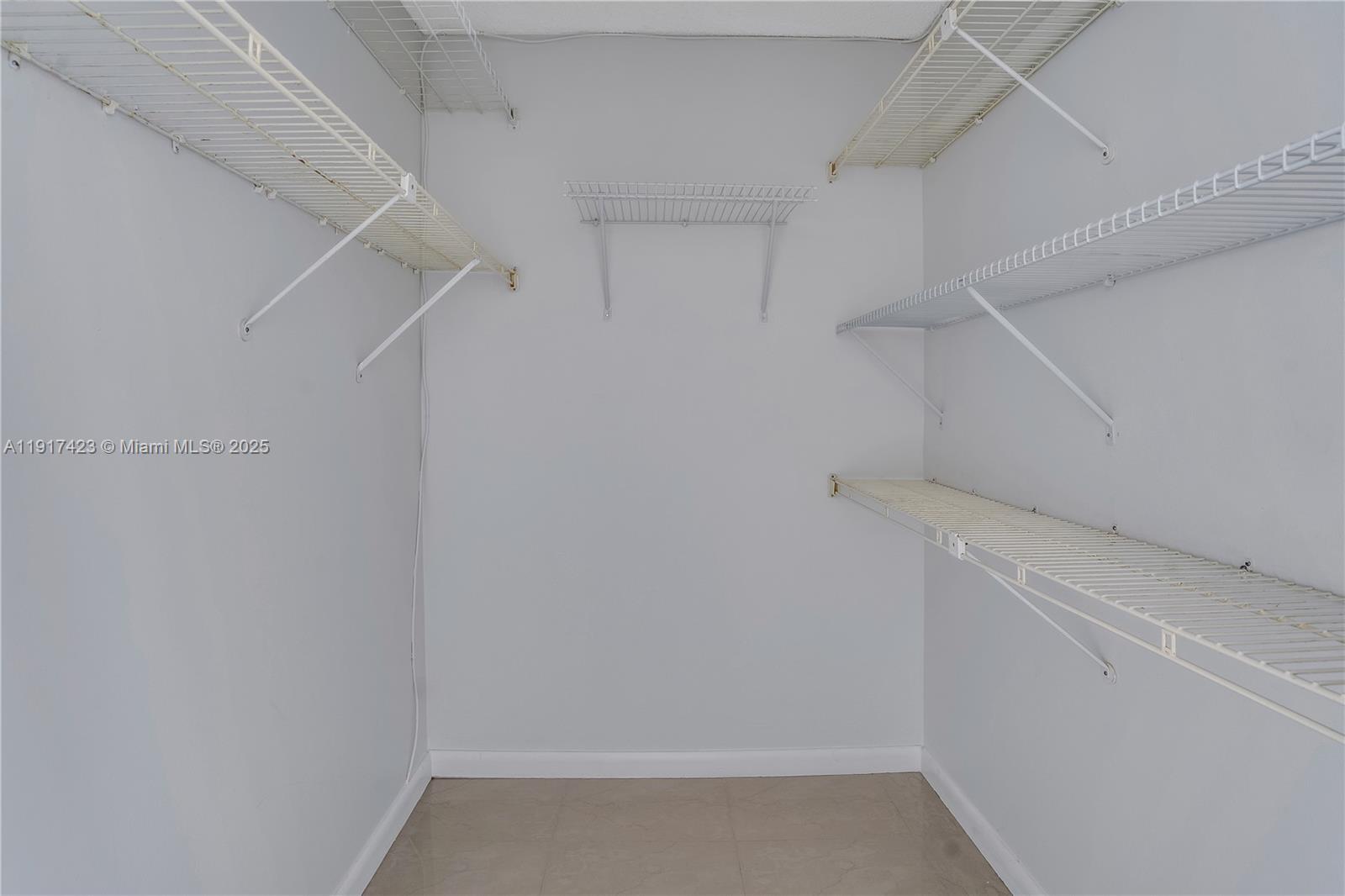 1200 St Charles Place, Unit 716 Pembroke Pines, FL 33026 - Photo 13 of 29 a view of storage and utility room with racks on the wall