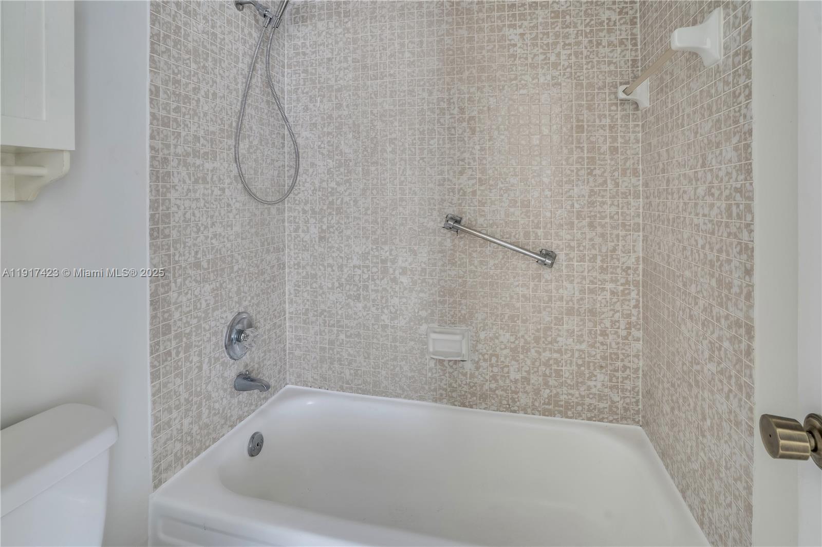 1200 St Charles Place, Unit 716 Pembroke Pines, FL 33026 - Photo 15 of 29 a bathroom with a bath tub with a shower