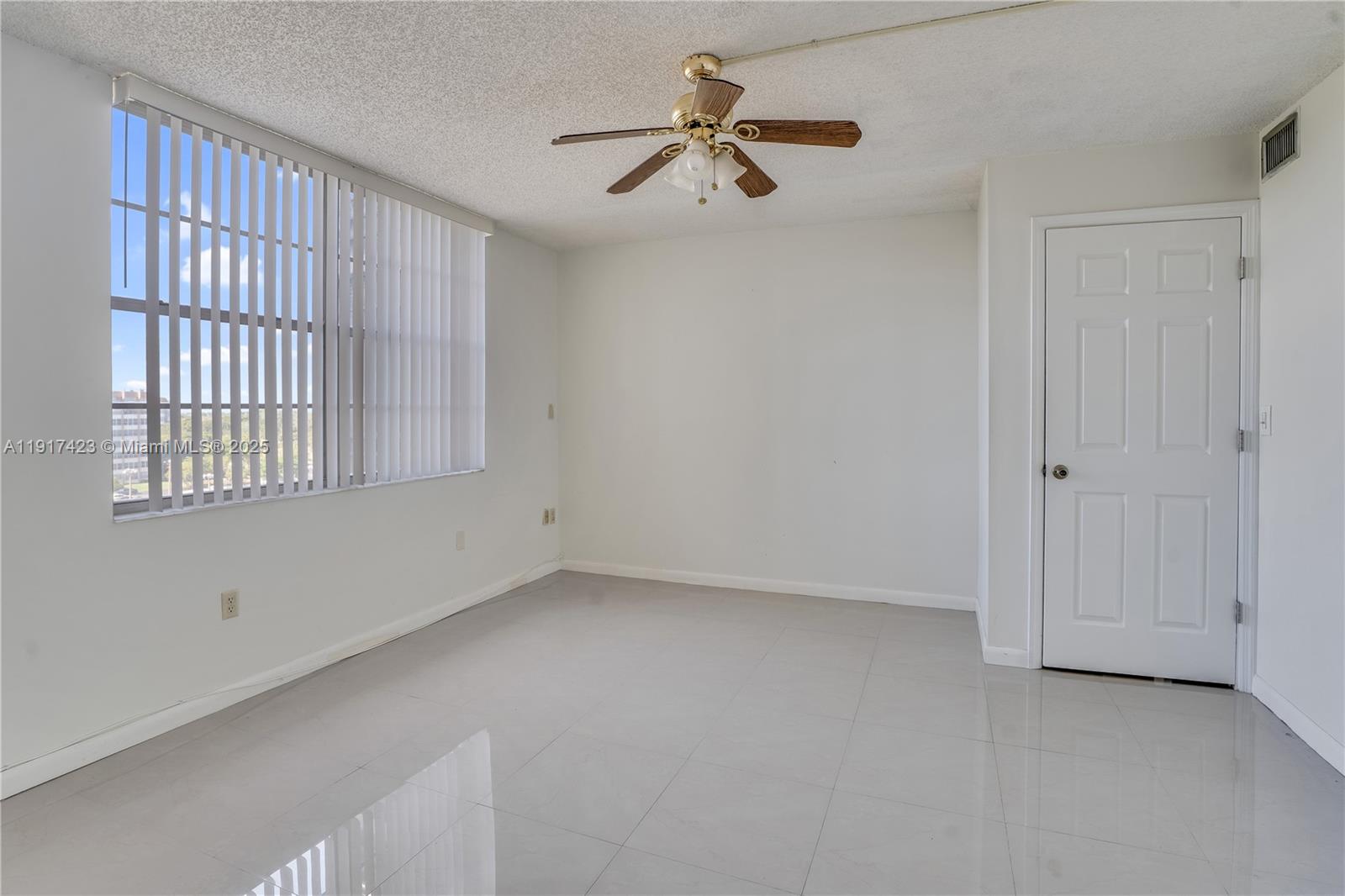 1200 St Charles Place, Unit 716 Pembroke Pines, FL 33026 - Photo 18 of 29 a view of an empty room with a window
