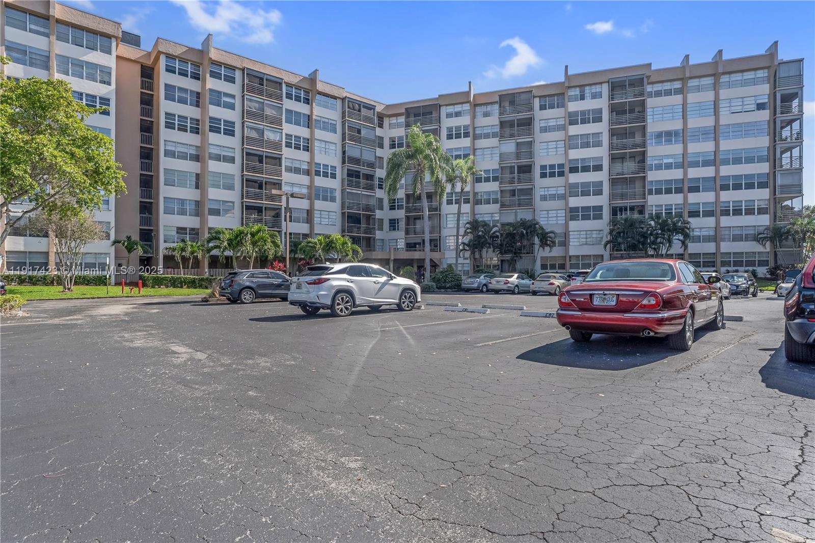 1200 St Charles Place, Unit 716 Pembroke Pines, FL 33026 - Photo 25 of 29 a car parked in front of a building