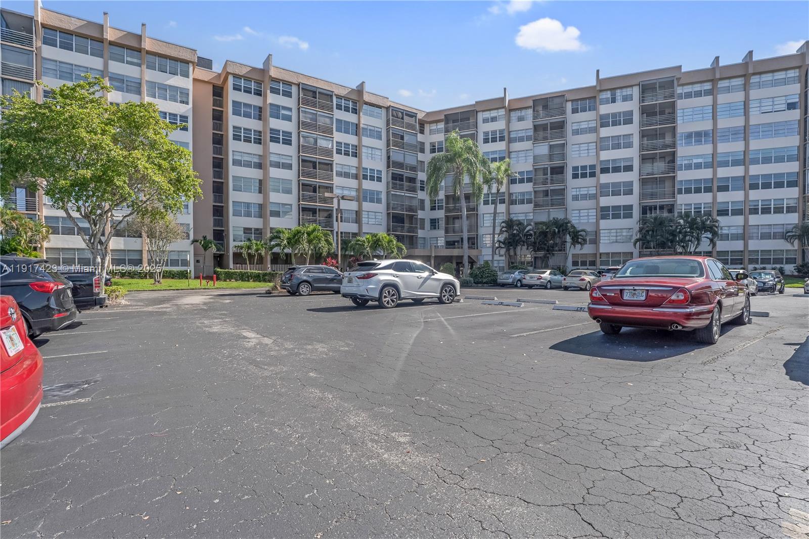 1200 St Charles Place, Unit 716 Pembroke Pines, FL 33026 - Photo 26 of 29 a car parked in front of brick building