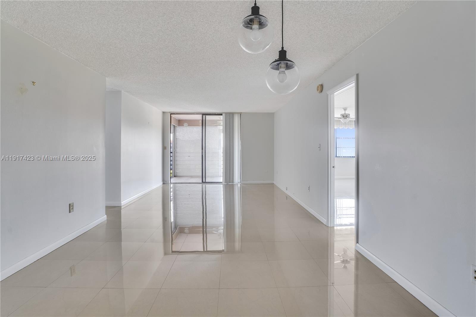 1200 St Charles Place, Unit 716 Pembroke Pines, FL 33026 - Photo 6 of 29 a view of a livingroom with wooden floor