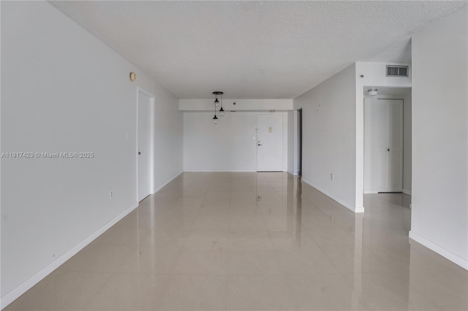 1200 St Charles Place, Unit 716 Pembroke Pines, FL 33026 - Photo 7 of 29 a view of a room with a hallway