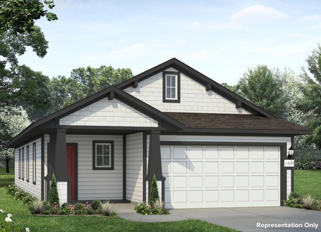 2600 Towy Road Manor, TX 78653 - Photo 1 of 1 a front view of a house with a yard and garage