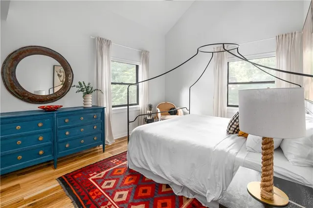 a view of entryway with wooden floor and a fireplace