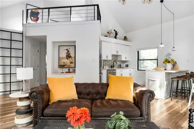 a view of a livingroom with furniture and window