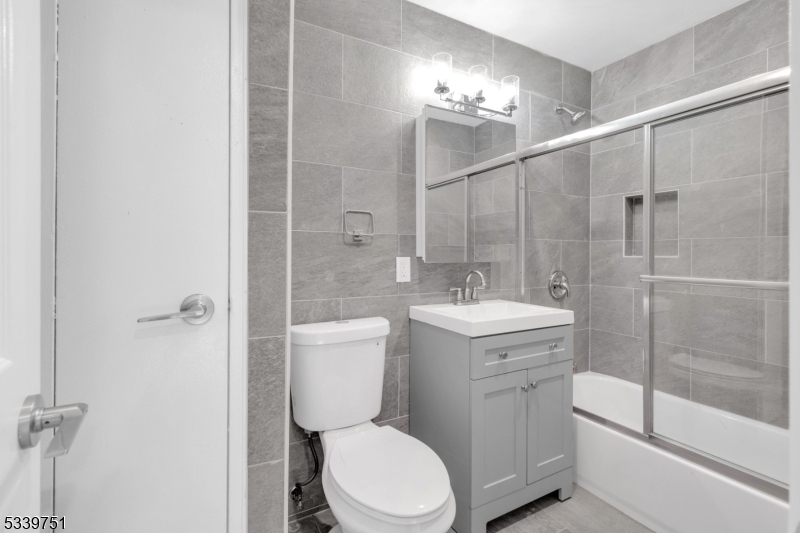 557 South Broad Street, Unit C2 Elizabeth, NJ 07202 - Photo 3 of 9 a bathroom with a toilet sink and shower