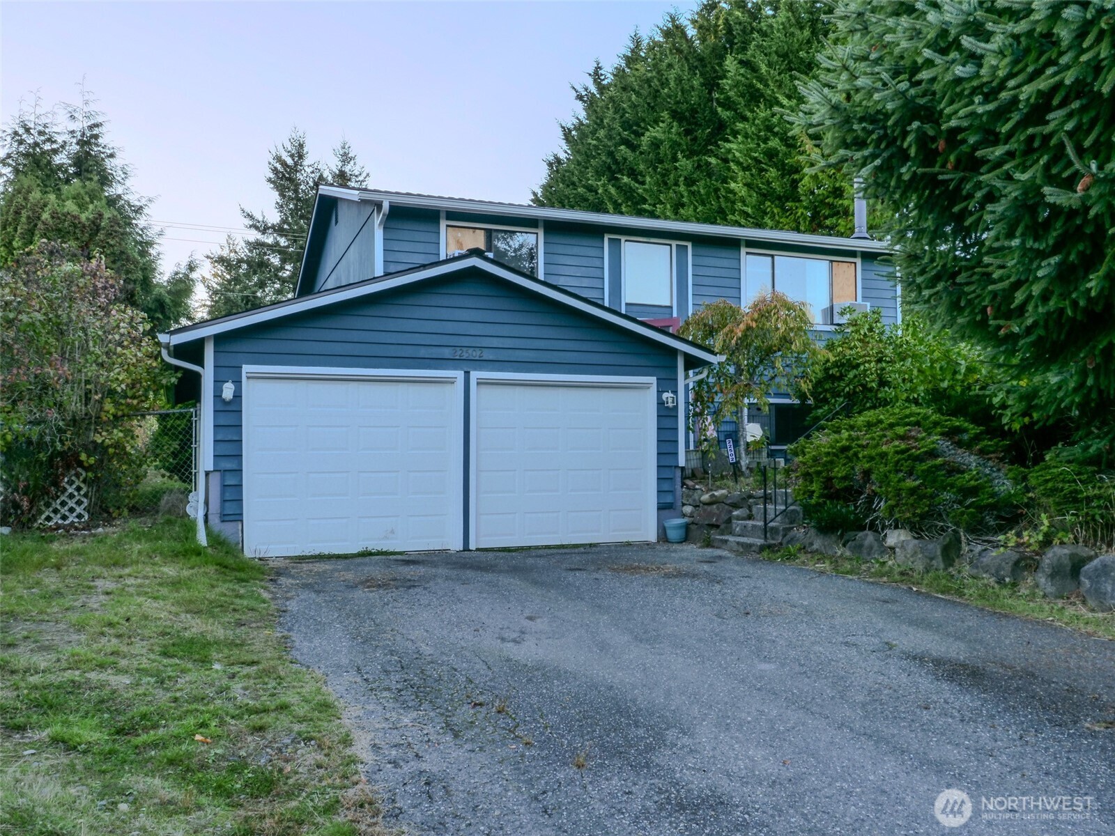 22502 3rd Place West Bothell, WA 98021 - Photo 2 of 10 a view of a house with a yard and garage