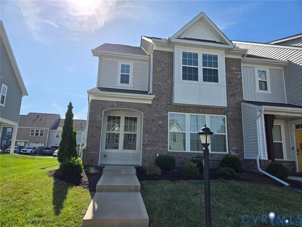 7825 Old Guild Road Richmond, VA 23237 - Photo 1 of 27 Brick and siding townhouse featuring a prominent b