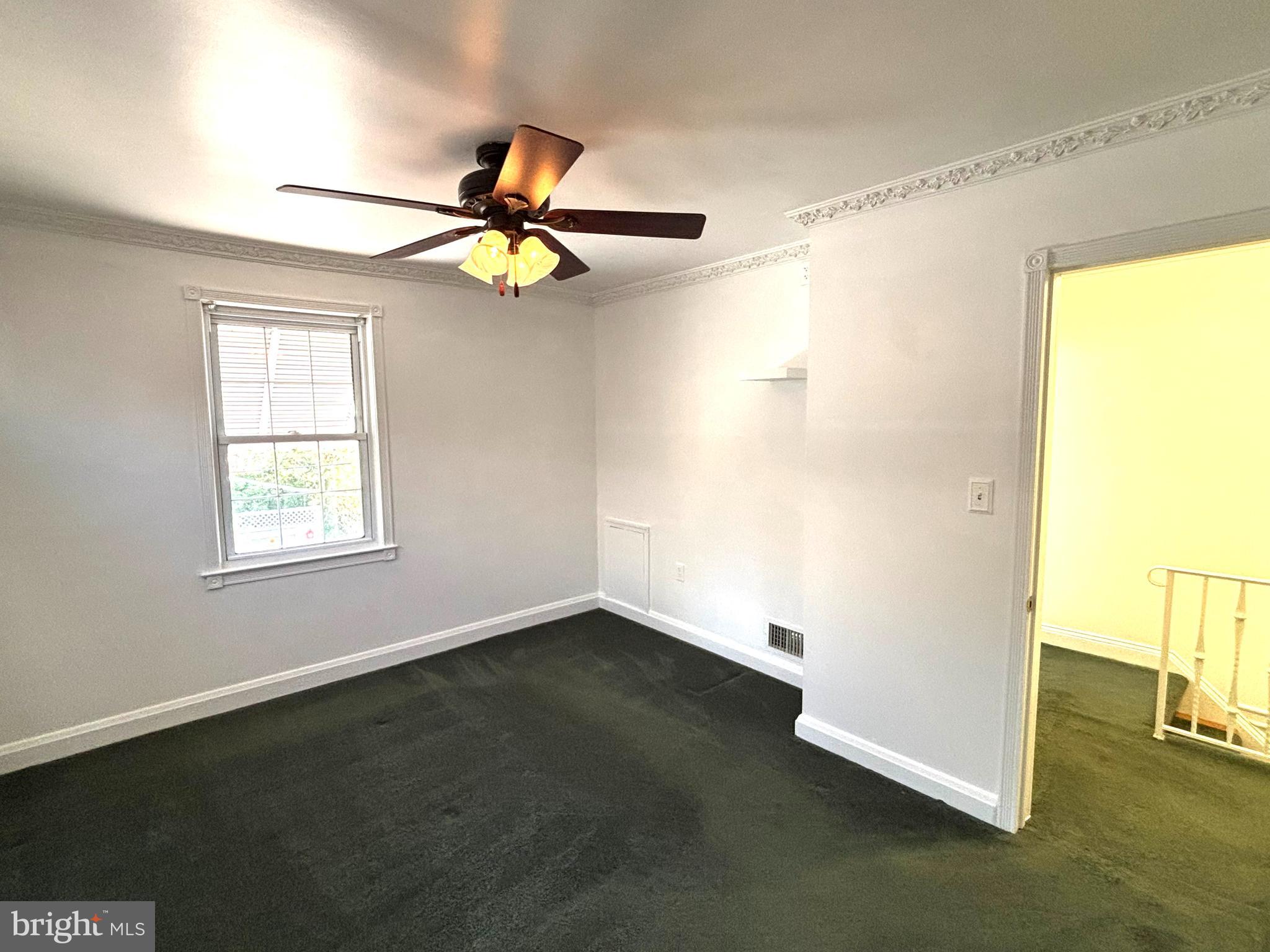 6527 Hilltop Avenue Baltimore, MD 21206 - Photo 13 of 32 a view of an empty room with a window