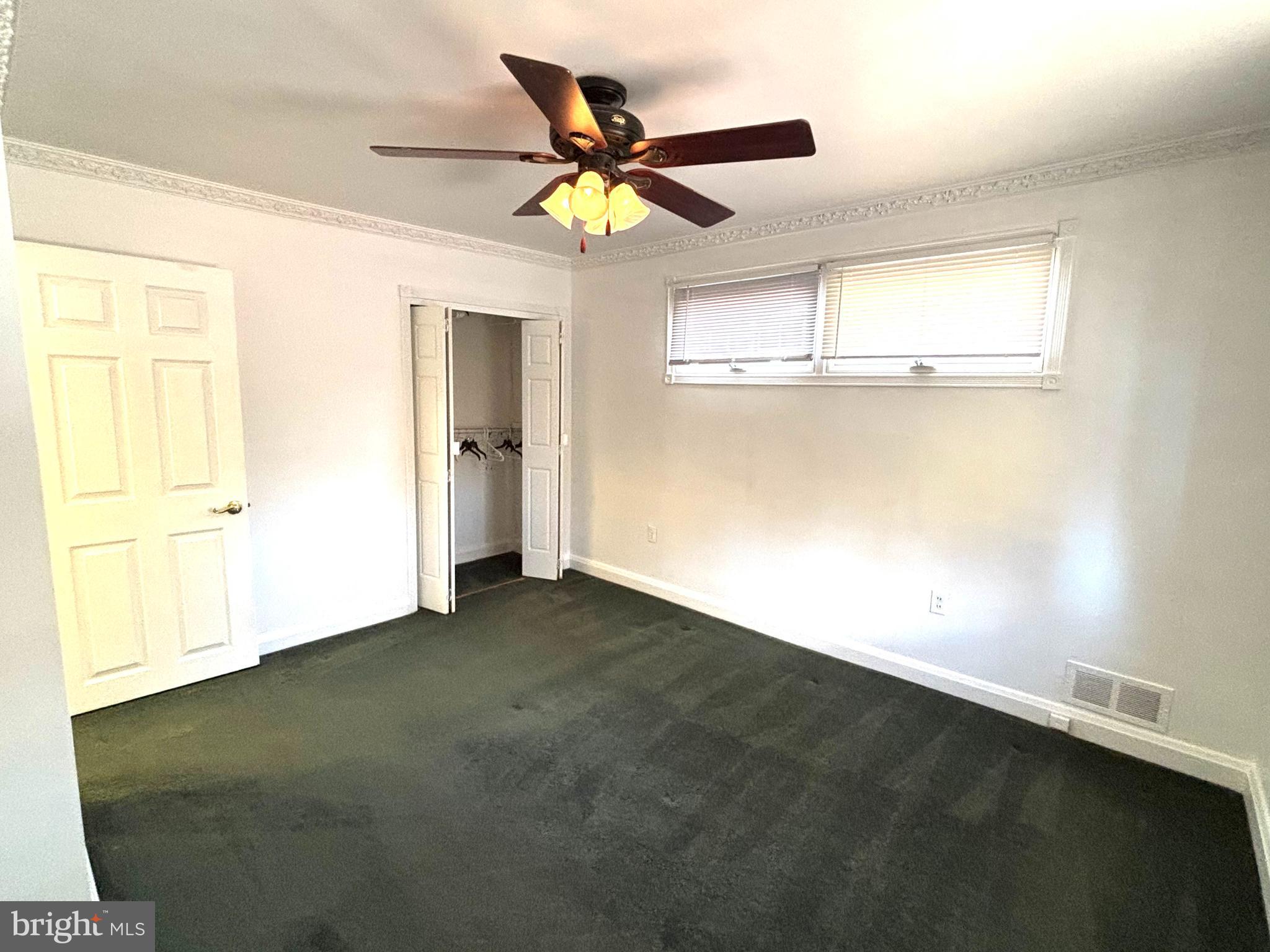 6527 Hilltop Avenue Baltimore, MD 21206 - Photo 18 of 32 a view of an empty room with a window