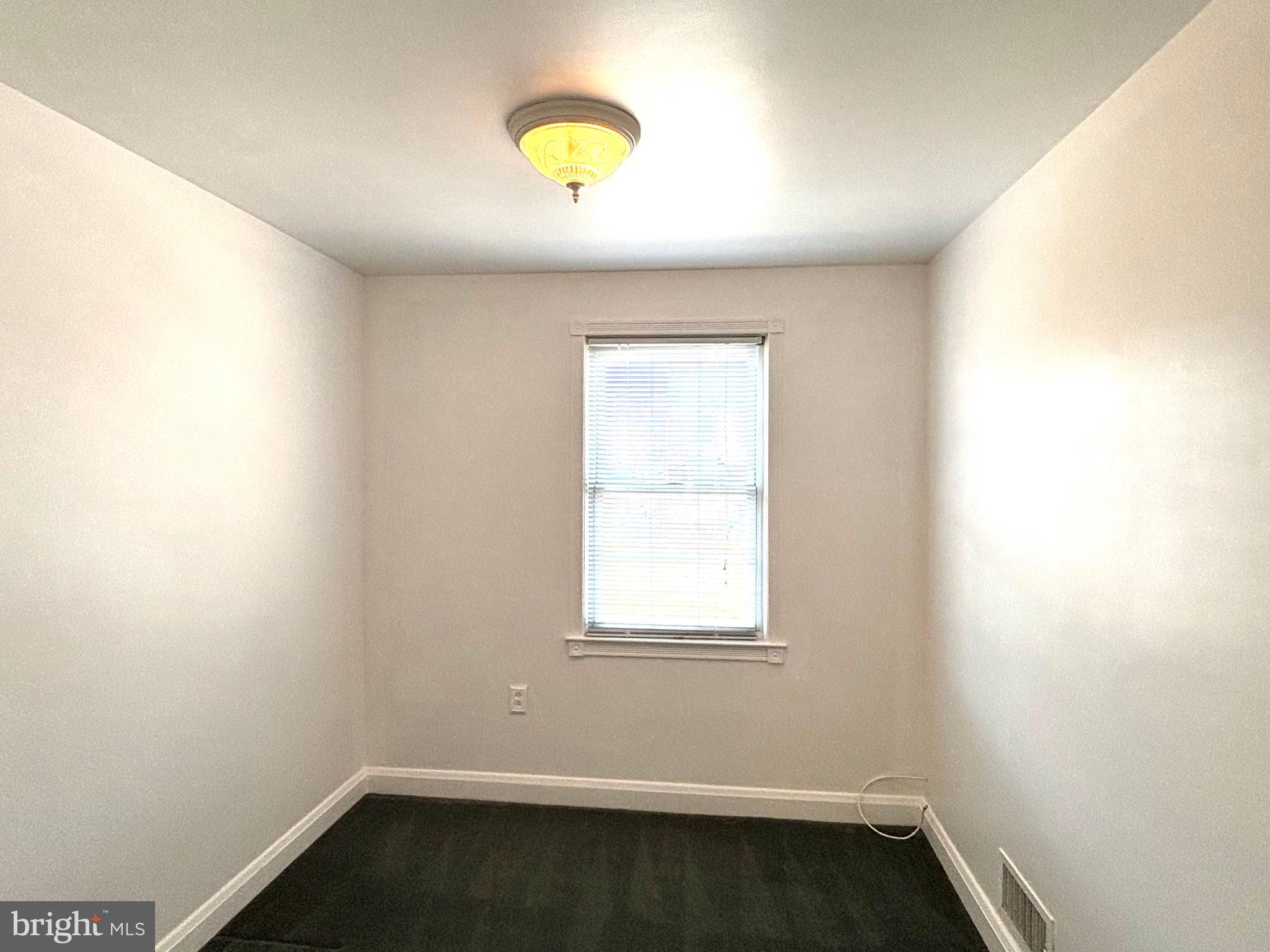 6527 Hilltop Avenue Baltimore, MD 21206 - Photo 19 of 32 an empty room with a window