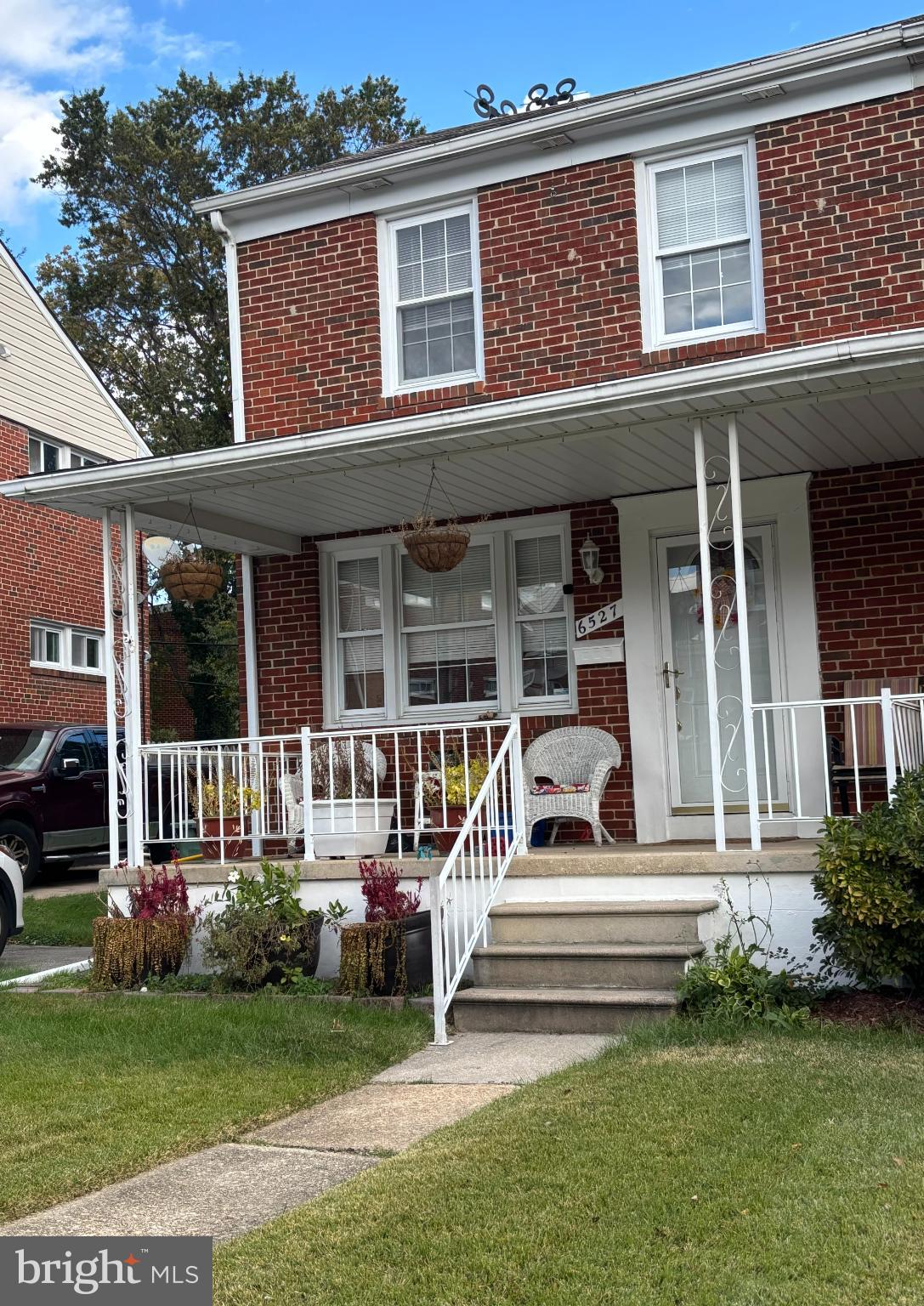 6527 Hilltop Avenue Baltimore, MD 21206 - Photo 6 of 32 a front view of a house with a garden