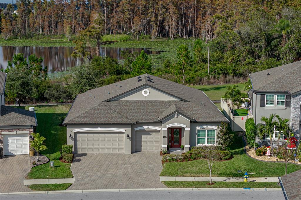 19493 Leonard Road Lutz, FL 33558 - Photo 1 of 1 a front view of house with yard and green space