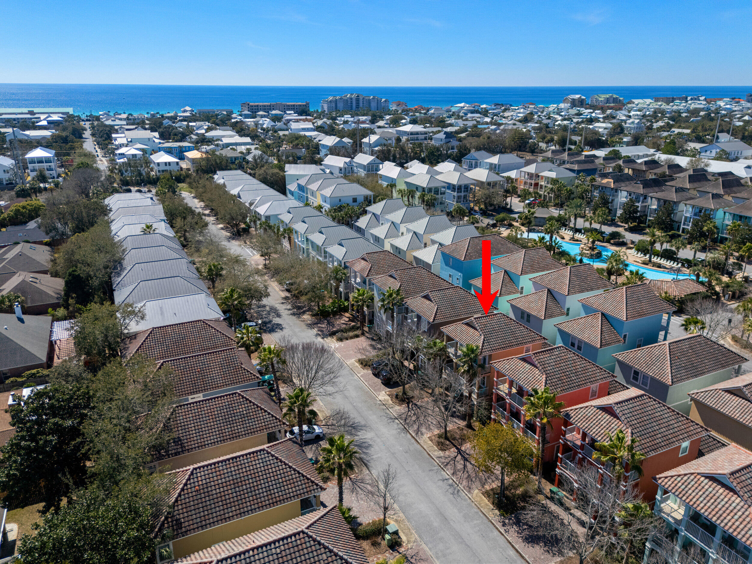 an aerial view of residential houses with outdoor space