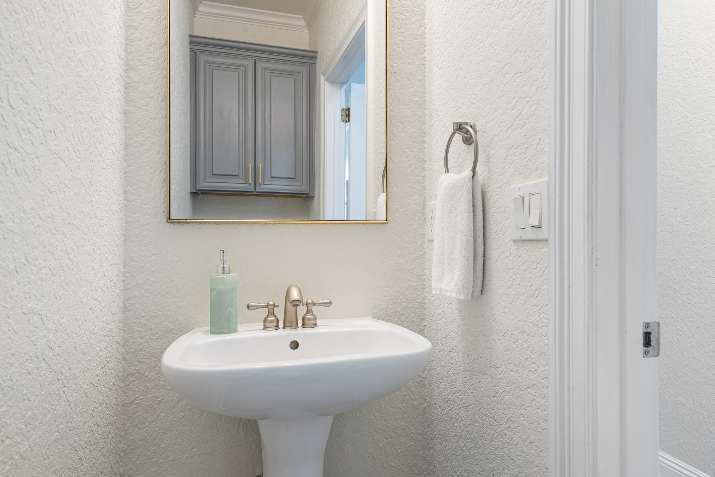 230 Kono Way Destin, FL 32541 - Photo 11 of 41 a bathroom with a sink and a mirror