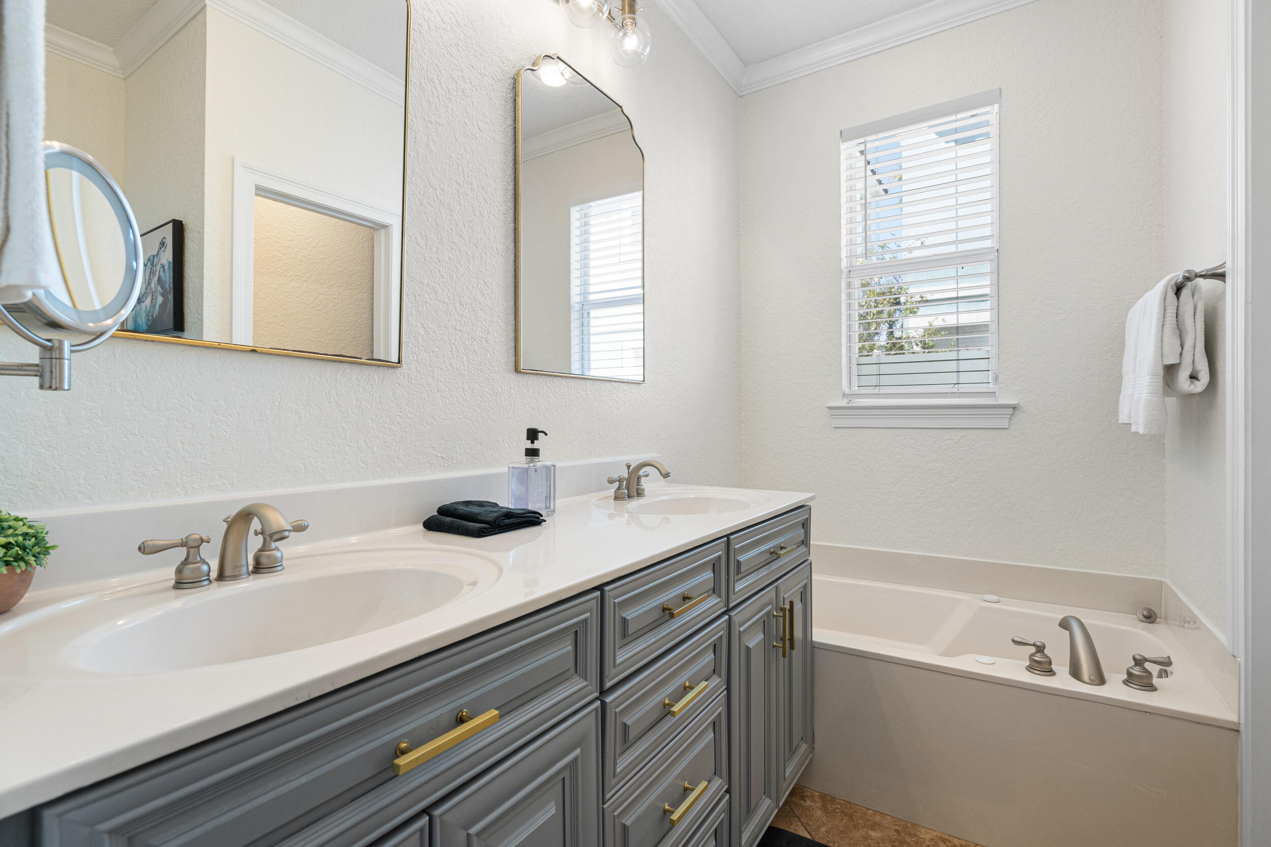 230 Kono Way Destin, FL 32541 - Photo 14 of 41 a bathroom with a double vanity sink mirror and bathtub