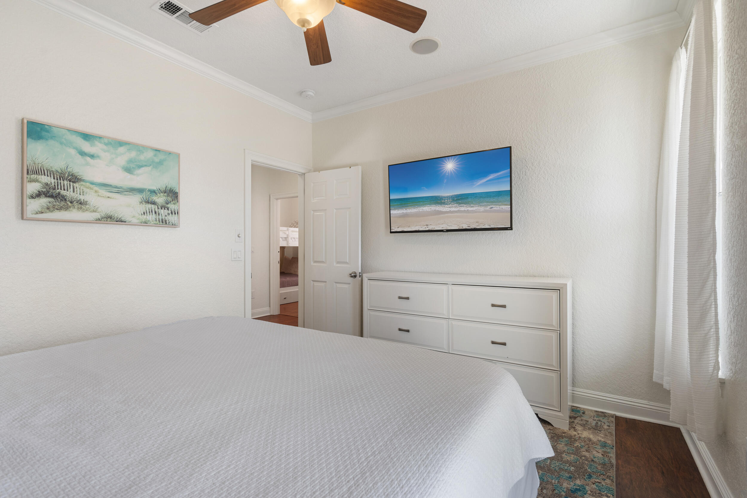 230 Kono Way Destin, FL 32541 - Photo 32 of 41 a bedroom with a bed and a painting on the wall