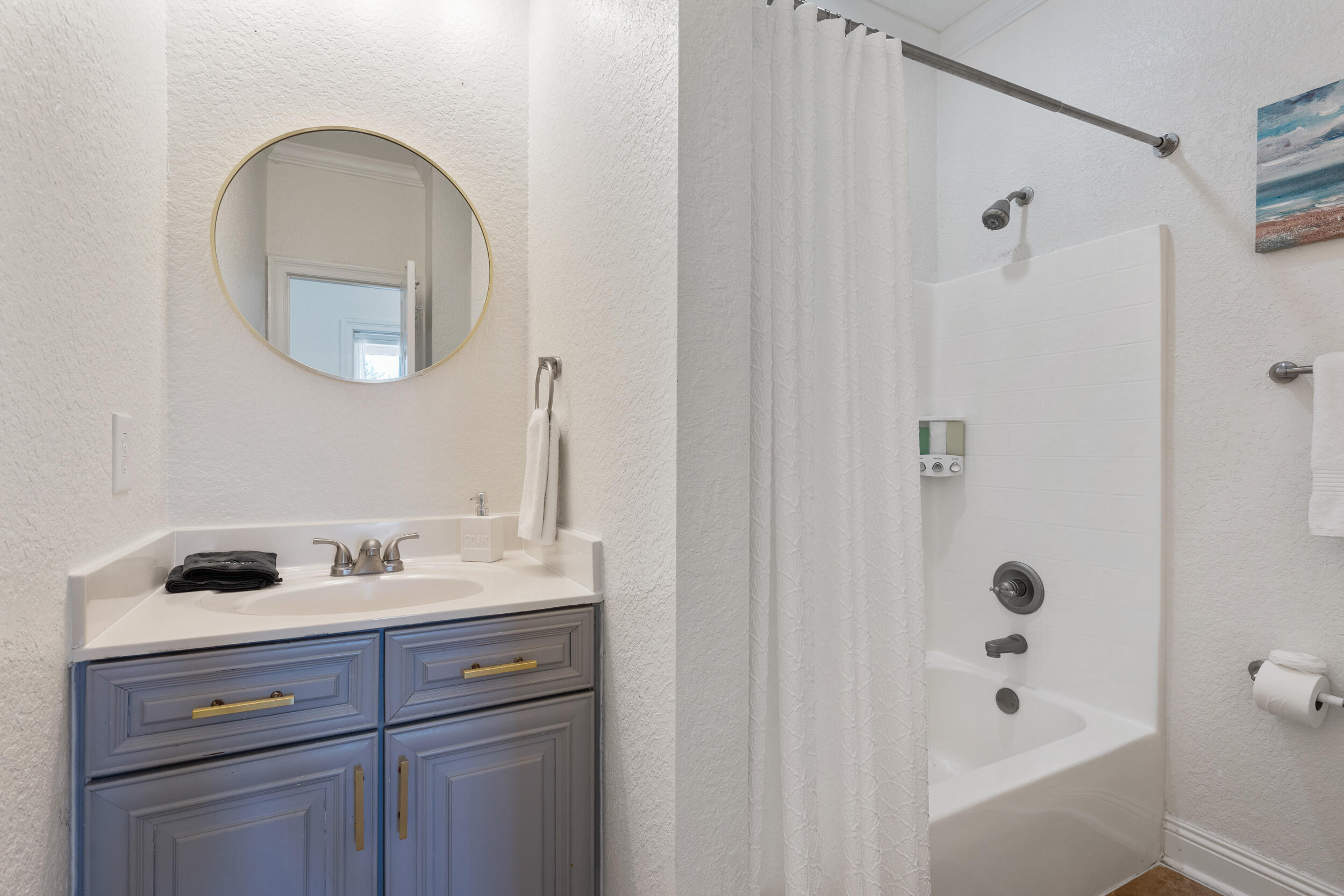 230 Kono Way Destin, FL 32541 - Photo 33 of 41 a bathroom with a tub sink and mirror