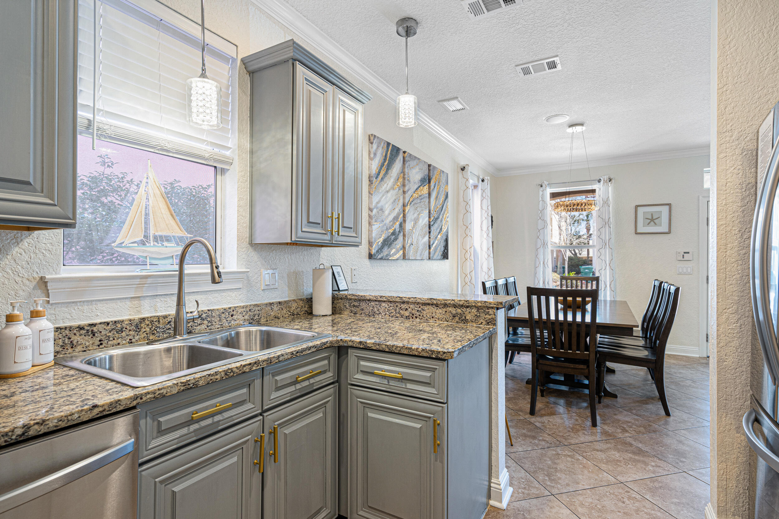 230 Kono Way Destin, FL 32541 - Photo 10 of 41 a kitchen that has a sink and chairs