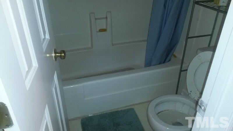6621 English Ivy Lane Raleigh, NC 27615 - Photo 5 of 17 a bathroom with a toilet and a shower