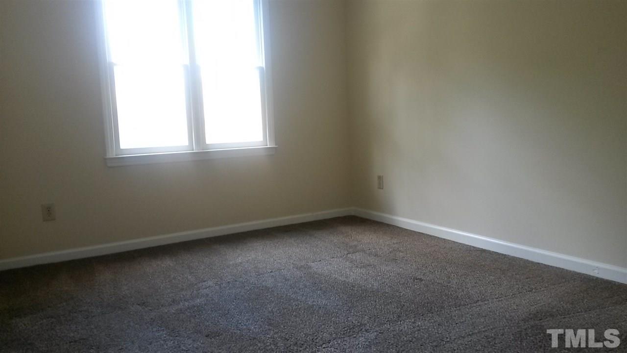6621 English Ivy Lane Raleigh, NC 27615 - Photo 8 of 17 an empty room with a window