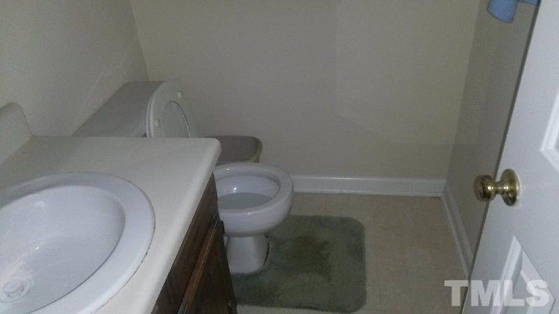 6621 English Ivy Lane Raleigh, NC 27615 - Photo 10 of 17 a close view of a toilet in a bathroom
