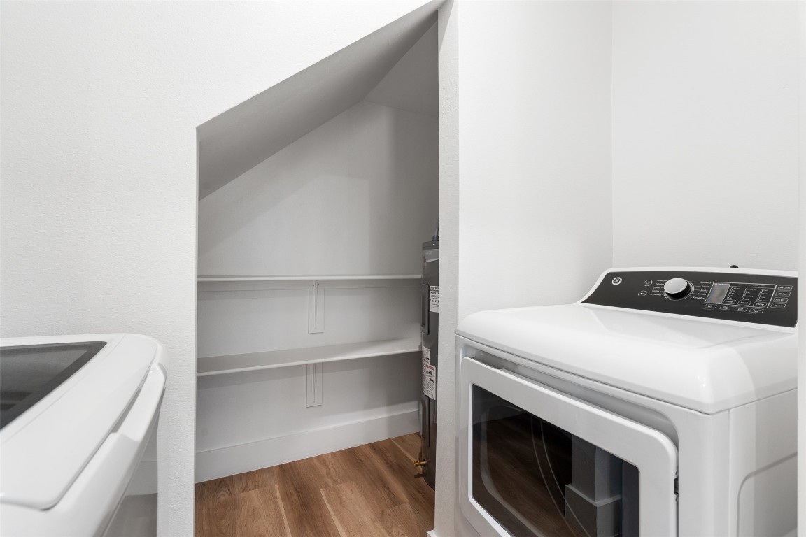 1901 Hearthstone Drive, Unit D Austin, TX 78757 - Photo 15 of 30 a utility room with dryer and washer