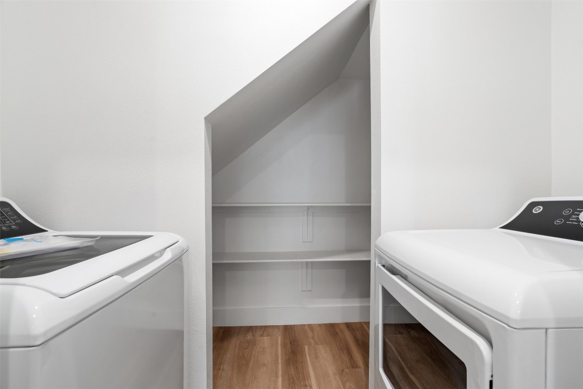 1901 Hearthstone Drive, Unit D Austin, TX 78757 - Photo 16 of 30 a utility room with dryer and washer
