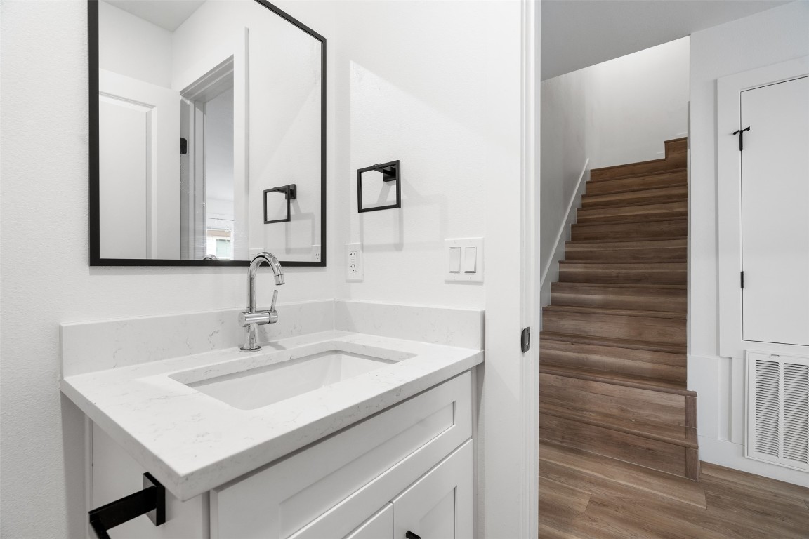 1901 Hearthstone Drive, Unit D Austin, TX 78757 - Photo 23 of 30 a bathroom with a sink and a mirror