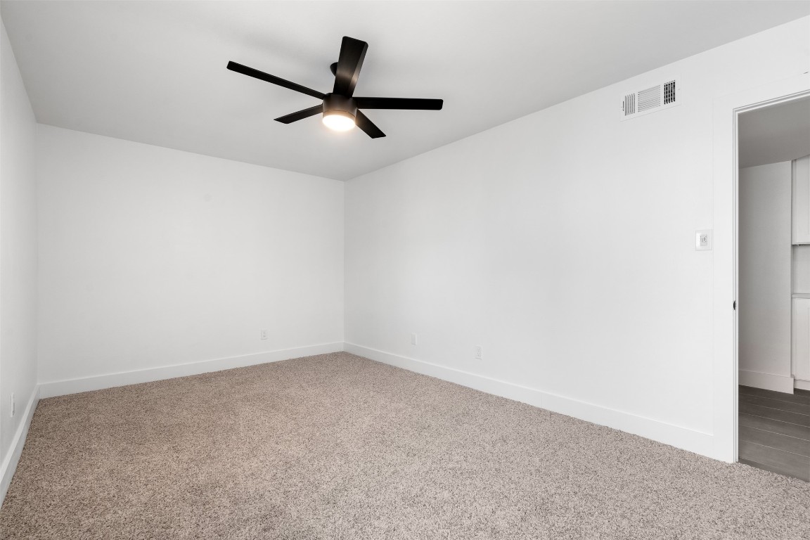 1901 Hearthstone Drive, Unit D Austin, TX 78757 - Photo 25 of 30 a view of a big room with carpet