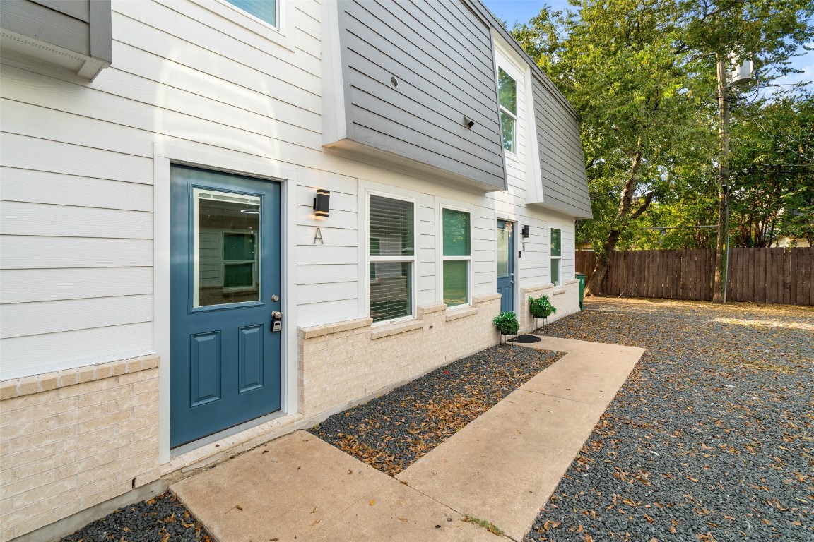 1901 Hearthstone Drive, Unit D Austin, TX 78757 - Photo 4 of 30 a view of a house with a backyard
