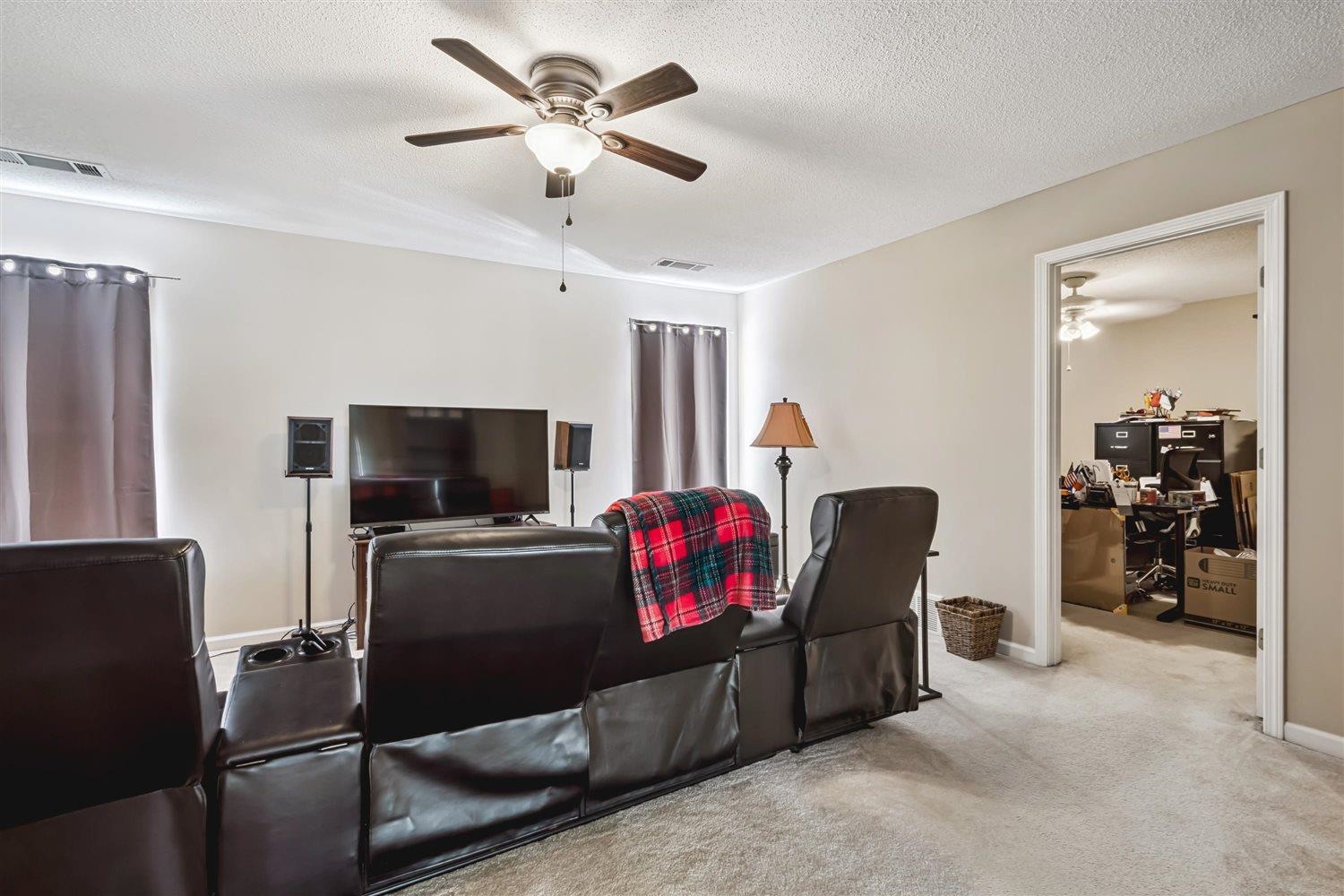 1489 John Ridge Drive Collierville, TN 38017 - Photo 27 of 39 a living room with furniture and a flat screen tv