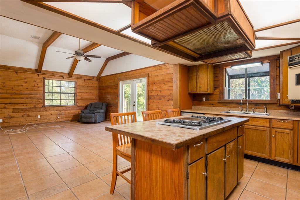 2641 McIntosh Road Dover, FL 33527 - Photo 15 of 58 a kitchen with stainless steel appliances granite countertop a stove a sink dishwasher and a stove