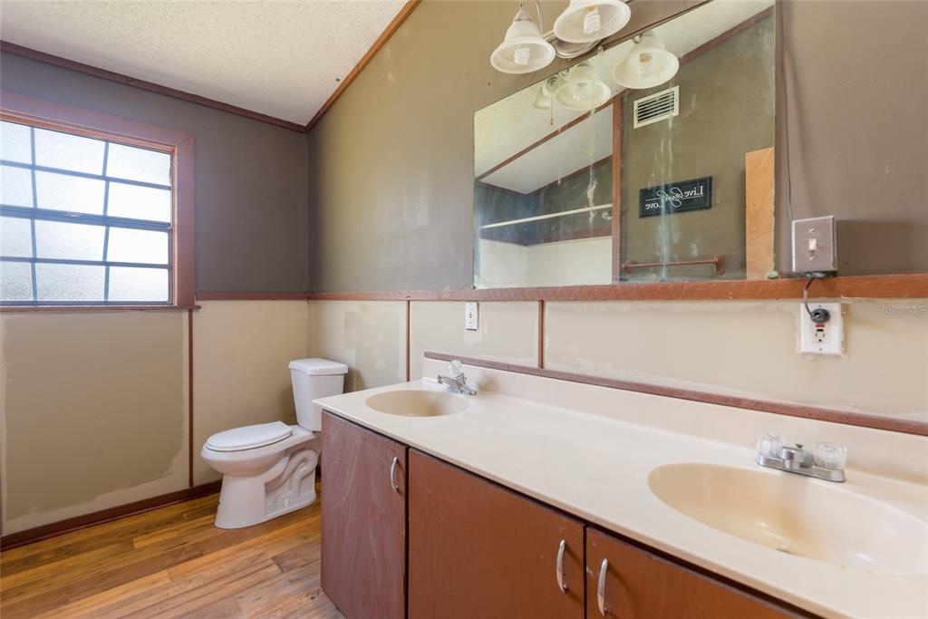 2641 McIntosh Road Dover, FL 33527 - Photo 28 of 58 a bathroom with a sink and a toilet