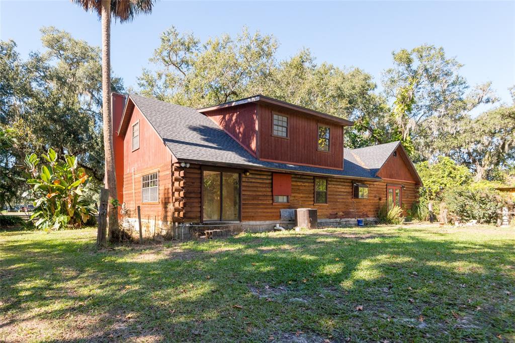 2641 McIntosh Road Dover, FL 33527 - Photo 39 of 58 a view of a house with a yard